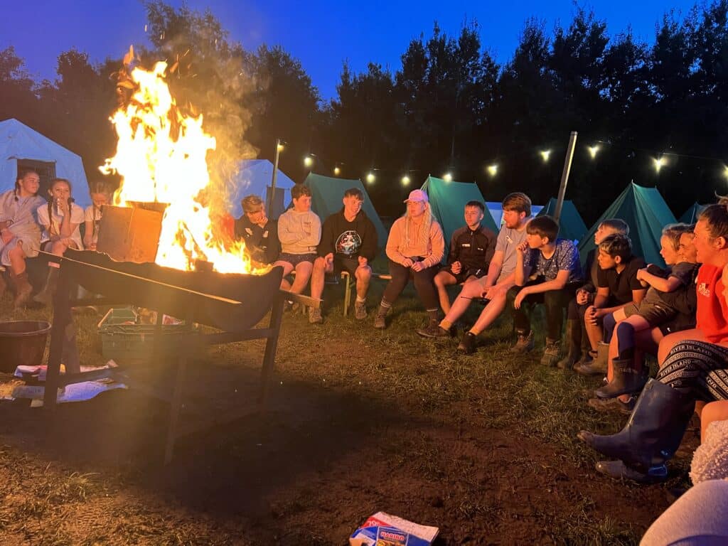 Participants of the BHY Senior Camp enjoy ‘The embarrassing life of Lottie Brookes’ - a story about an 11-year-old girl heading into Year 7 - around the campfire.